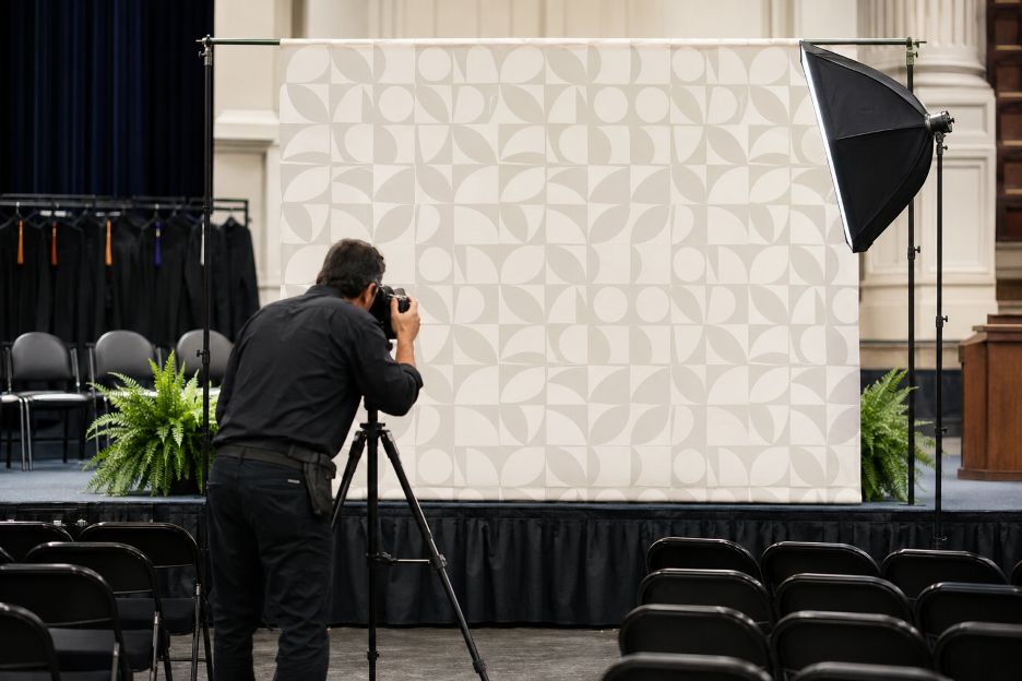 Photographer Tests Geometric Commencement Backdrop