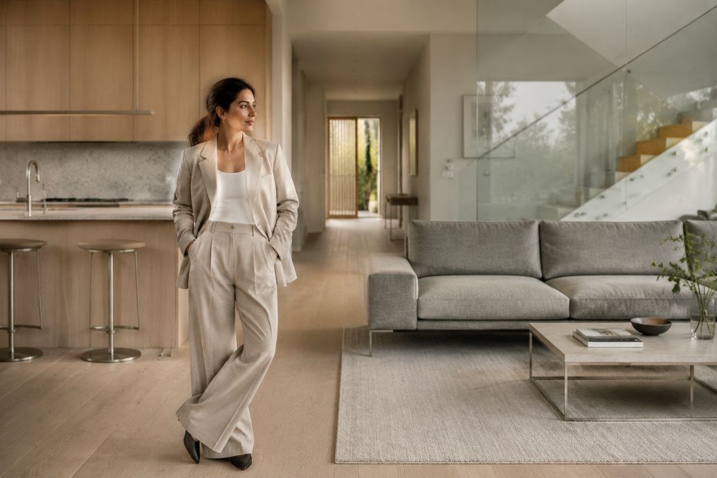 Stylish homeowner in a serene open-plan interior